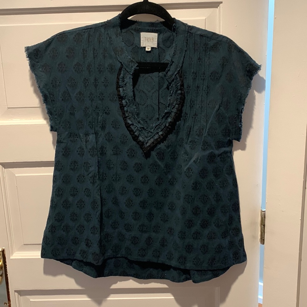 Teal top with black details